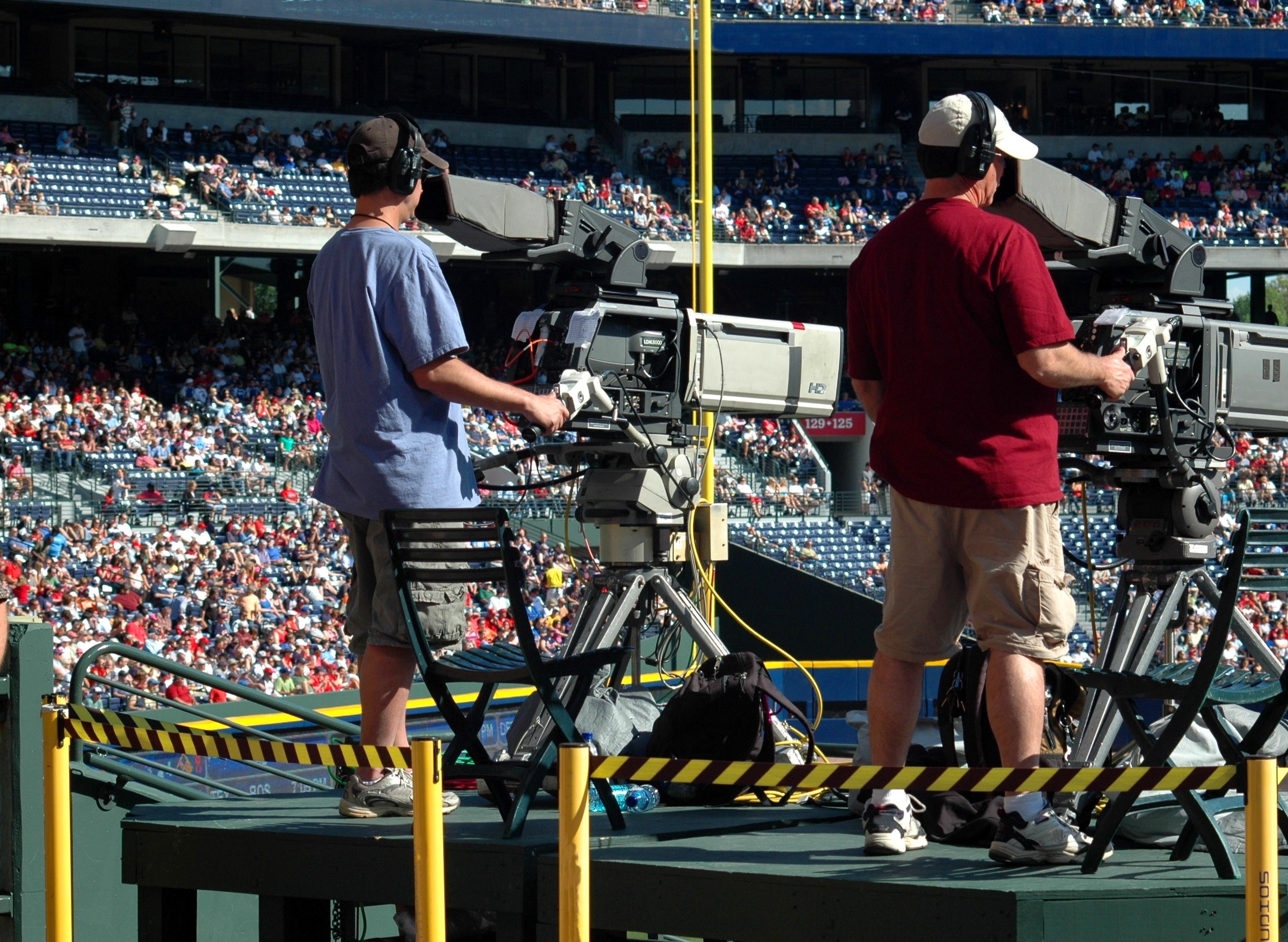 Camera people taking video at a sporting venue